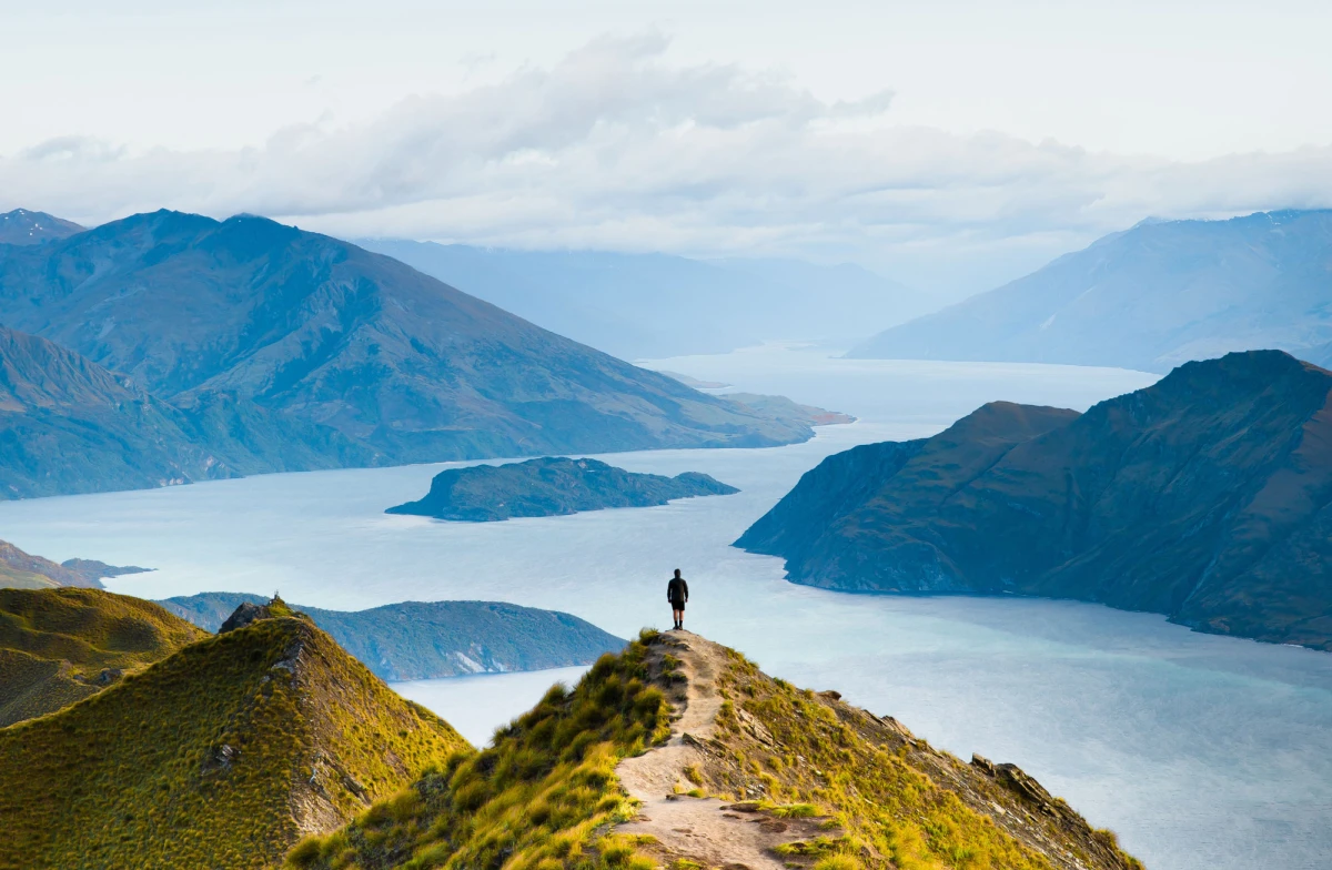 Roys peak mountain hike in Wanaka New Zealand. Popular tourism travel destination. Concept for hiking travel and adventure. New Zealand landscape background